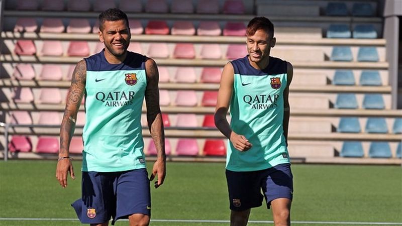 Neymar sharing a joke with Daniel Alves