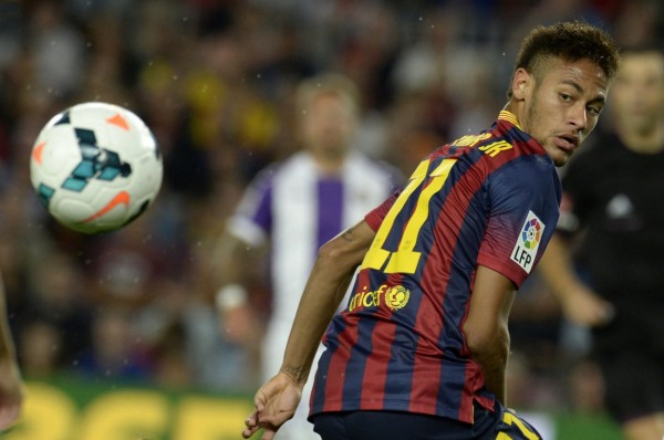 Neymar looking at the ball bouncing at his back