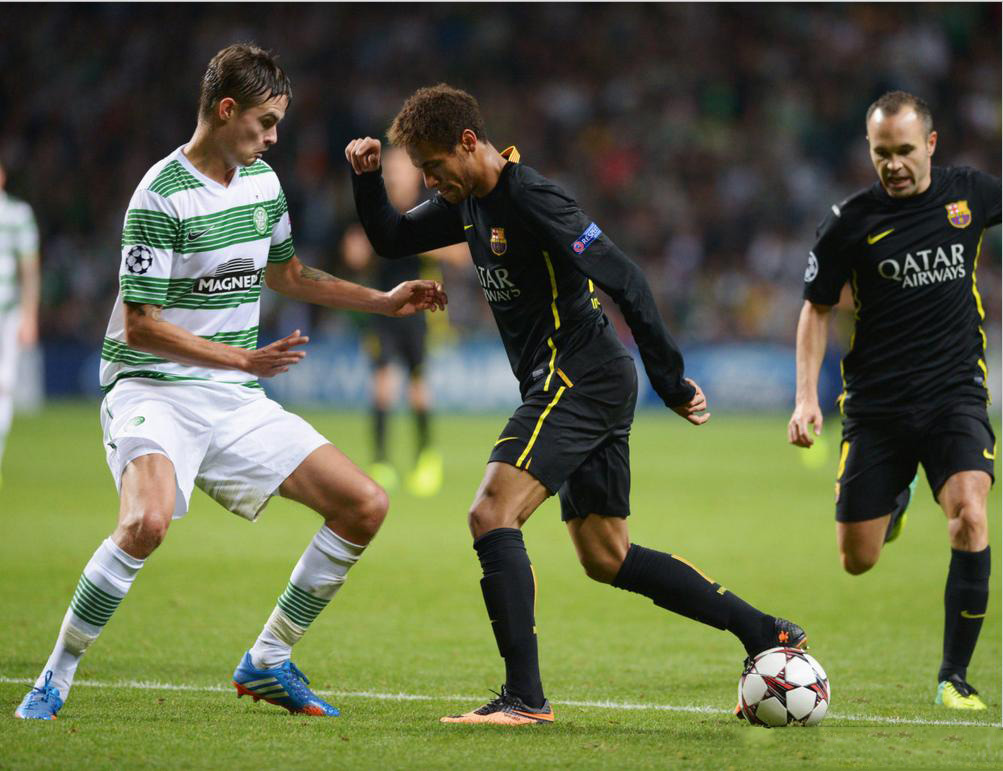 Neymar trying a new dribbling trick, with Iniesta near him