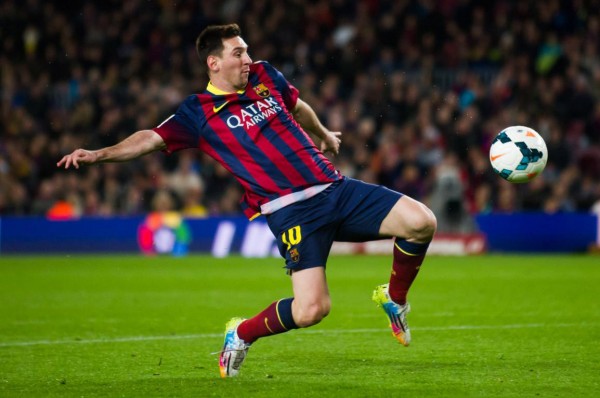 Lionel Messi reaching to the ball