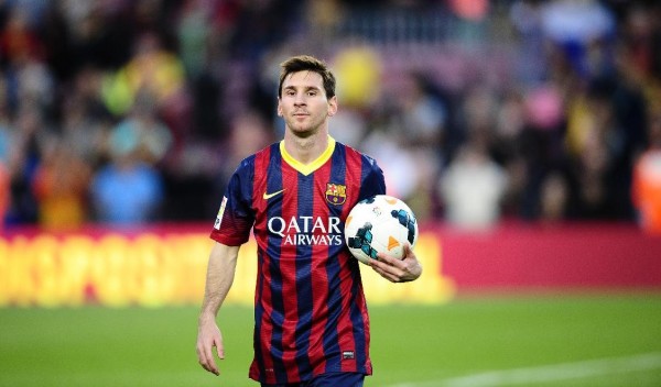 Lionel Messi taking his hat-trick game ball home