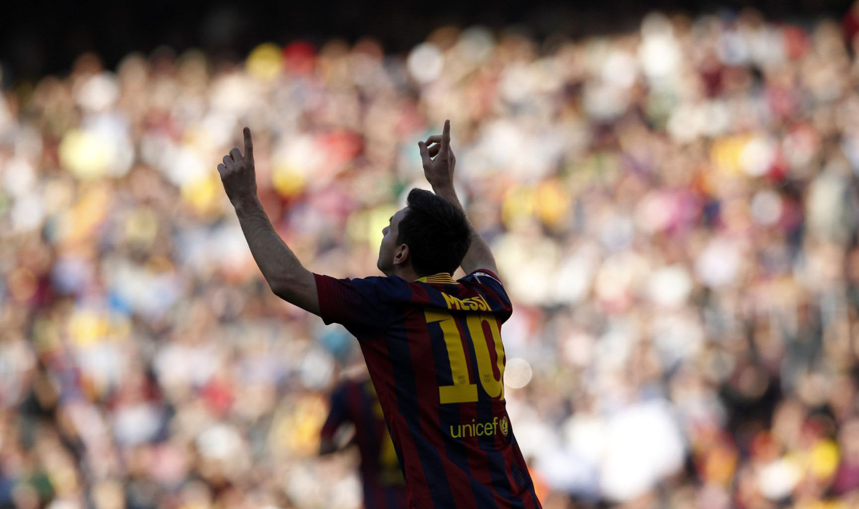 Messi sticking his two fingers in the air