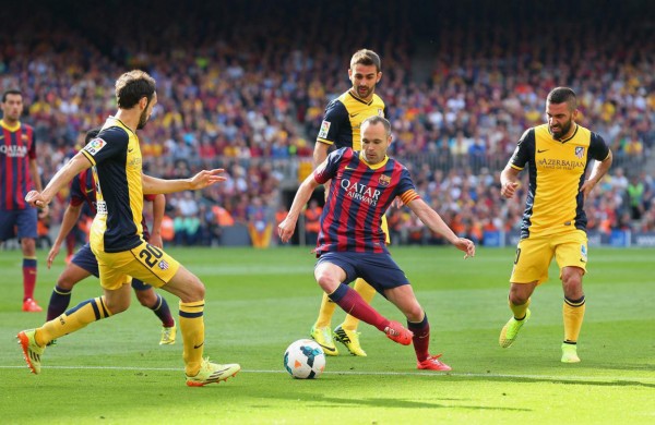 Andrés Iniesta playing in FC Barcelona vs Atletico Madrid, in 2014
