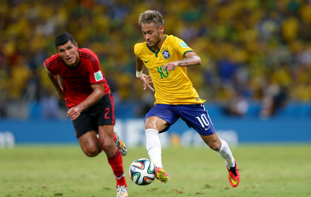 Neymar running with the ball in the FIFA World Cup 2014