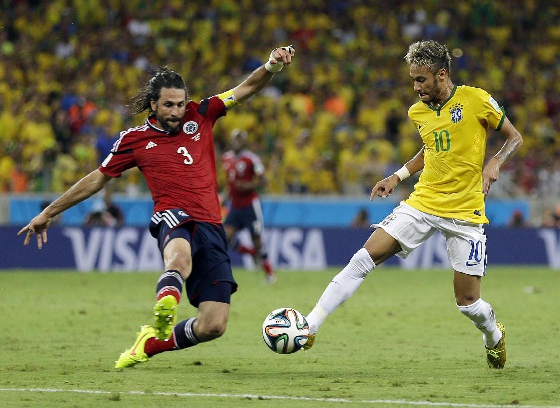 Neymar dribbling Yepes, in Brazil vs Colombia, at the FIFA World Cup 2014
