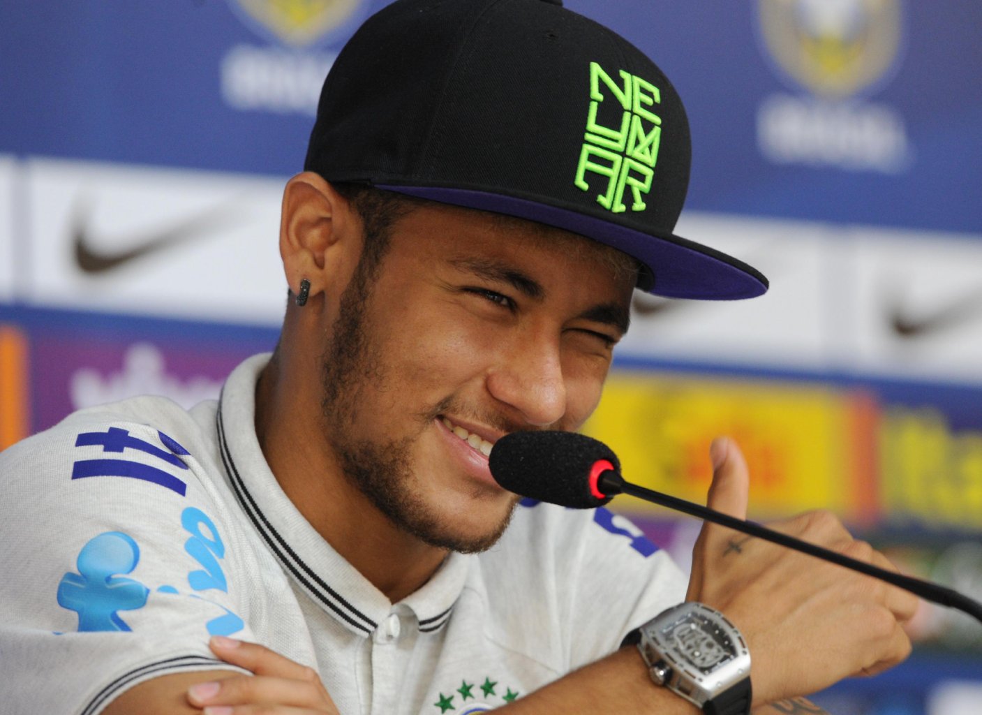 Neymar wearing a hat or cap of his own brand