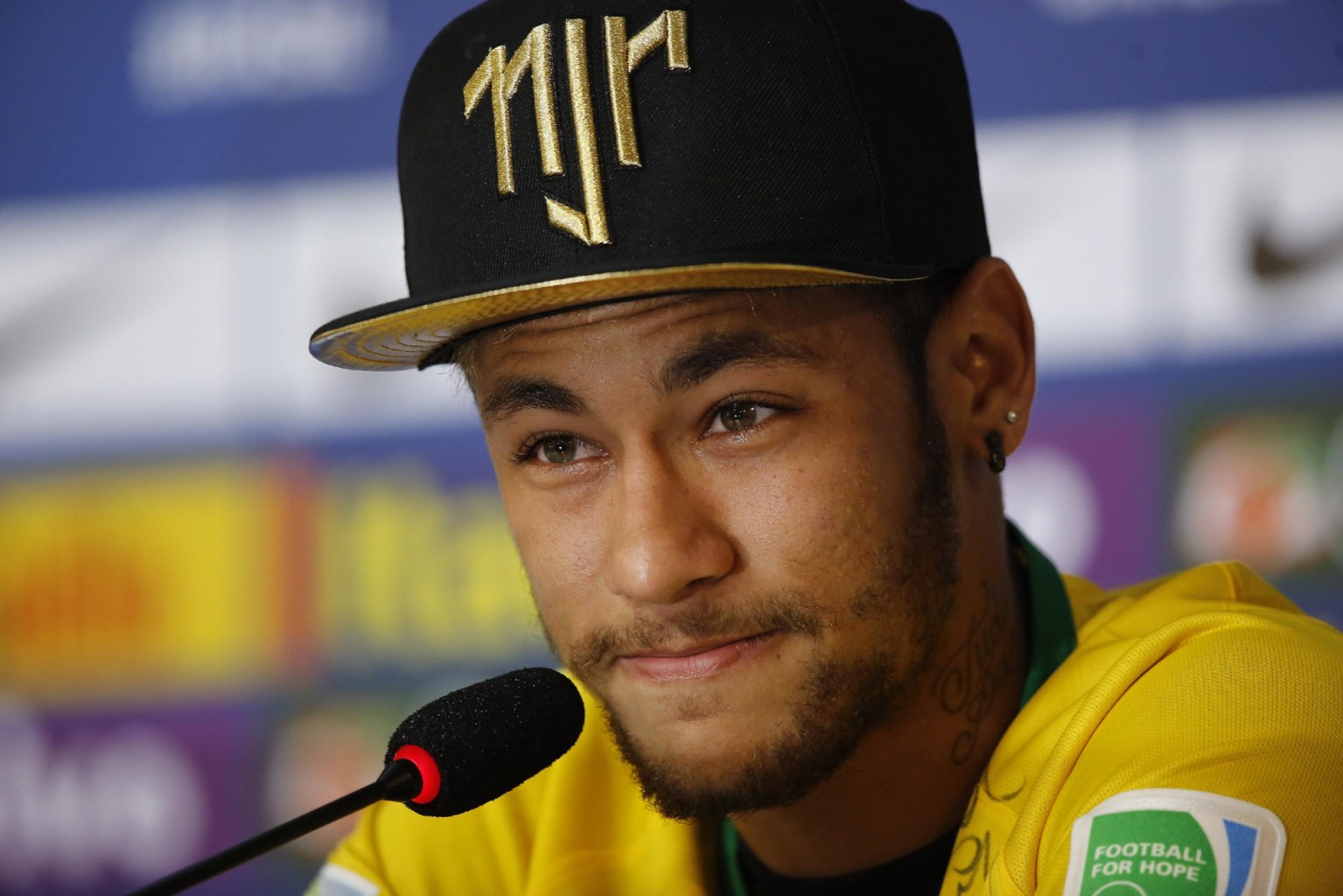 Neymar wearing a NJR hat and cap