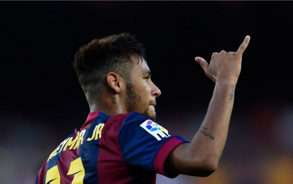Neymar making the hang loose hand gesture