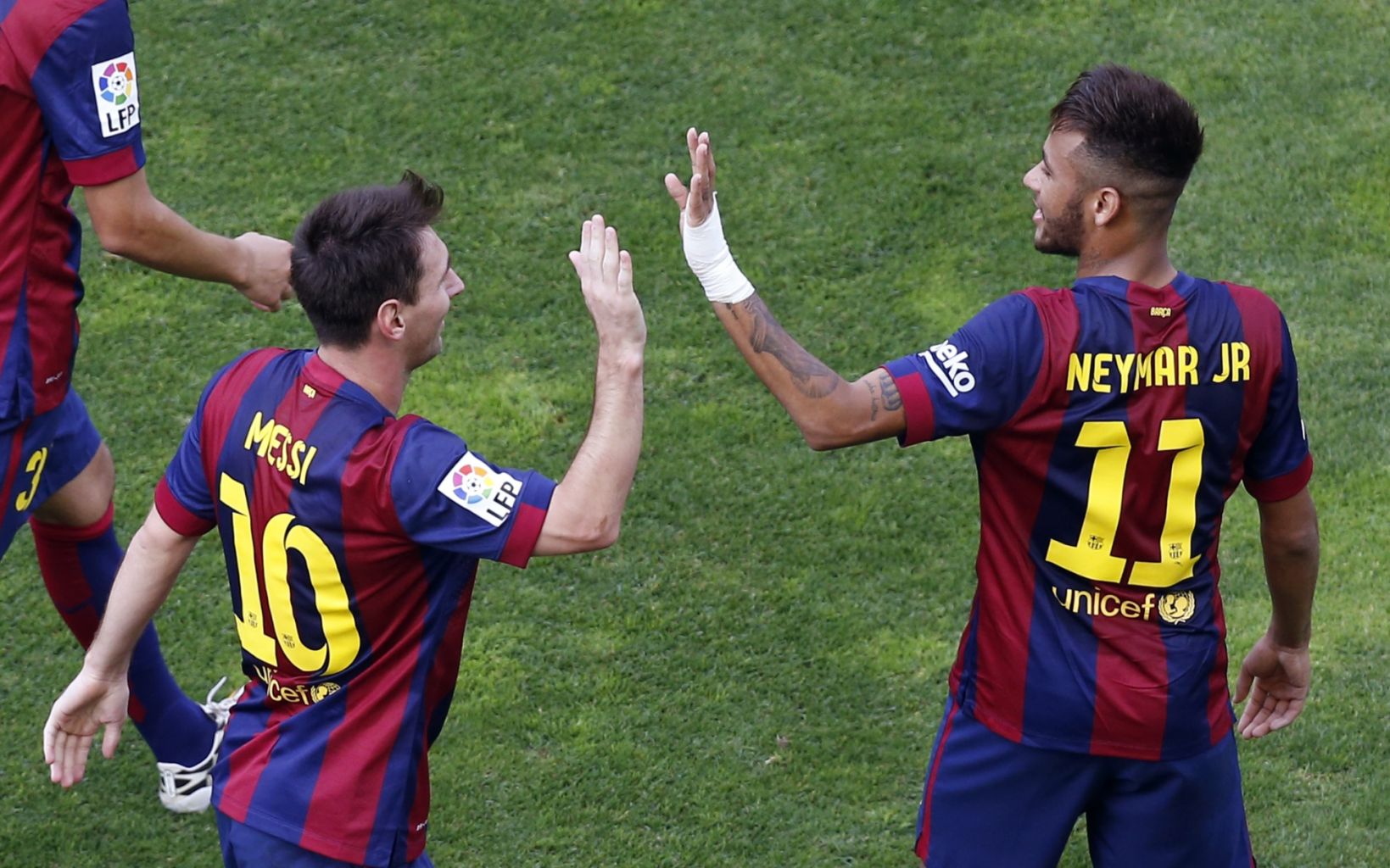 Messi and Neymar celebrating a goal