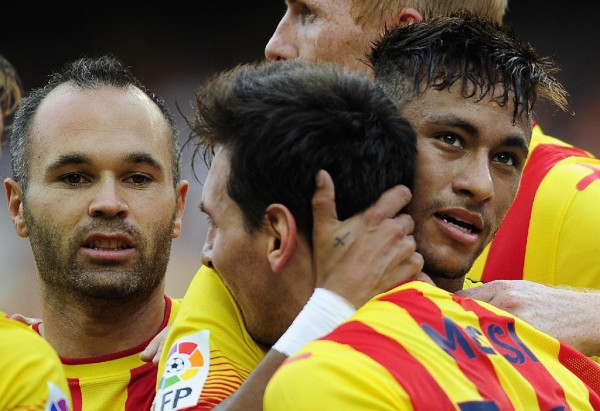 Neymar holding on to Lionel Messi neck