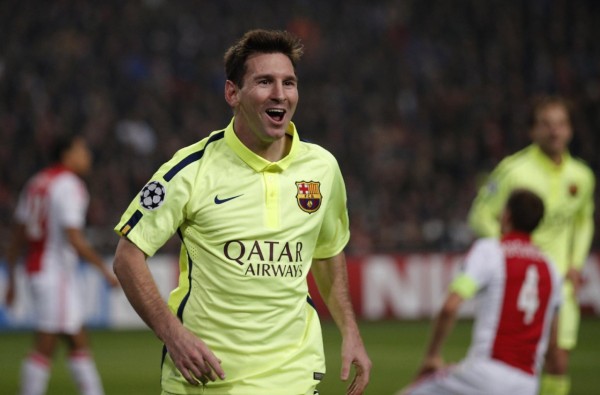 Lionel Messi celebrates scoring a brace for Barcelona, in the UEFA Champions League