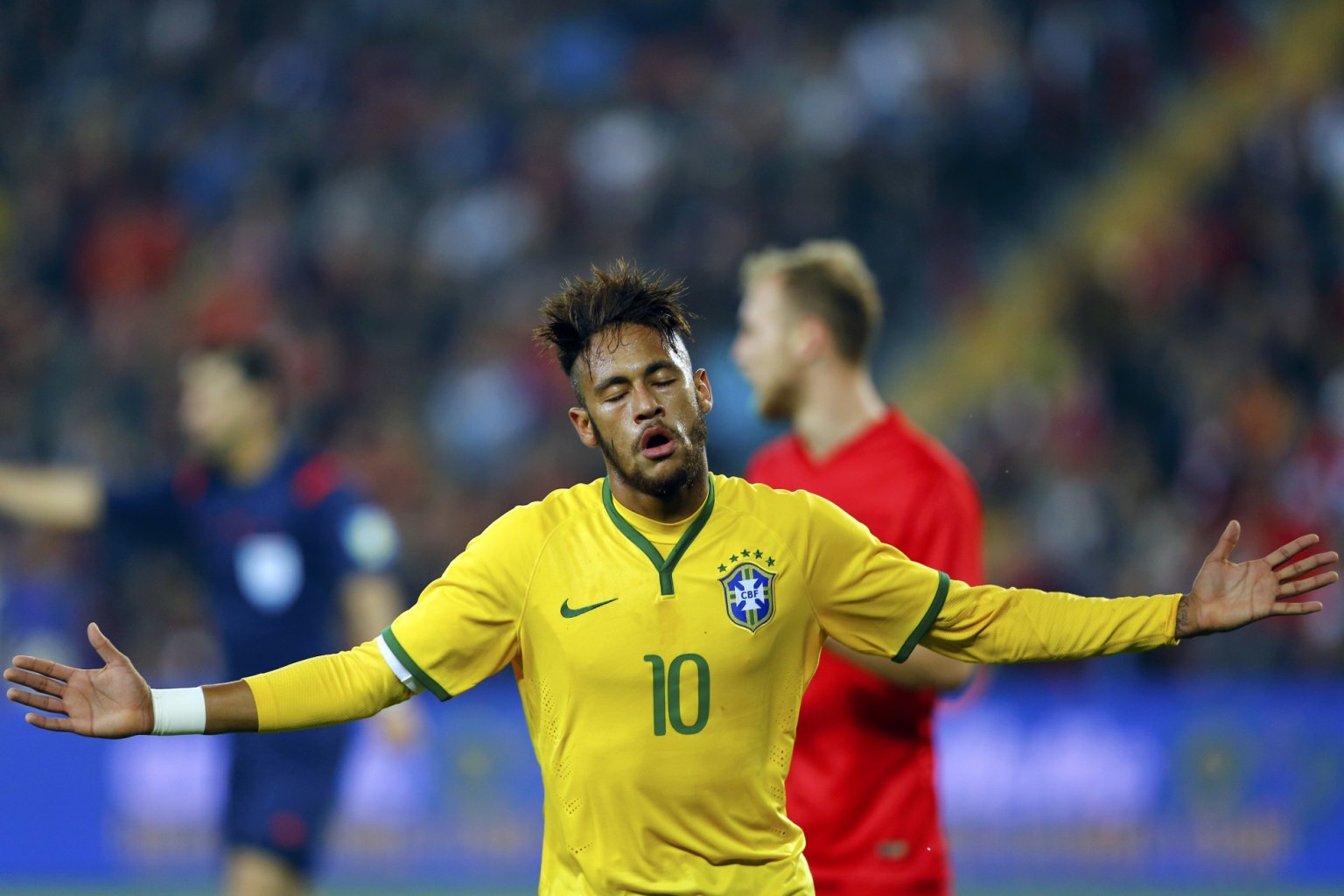 Neymar closing his eyes after scoring for Brazil