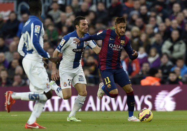 Neymar running away from an Espanyol defender