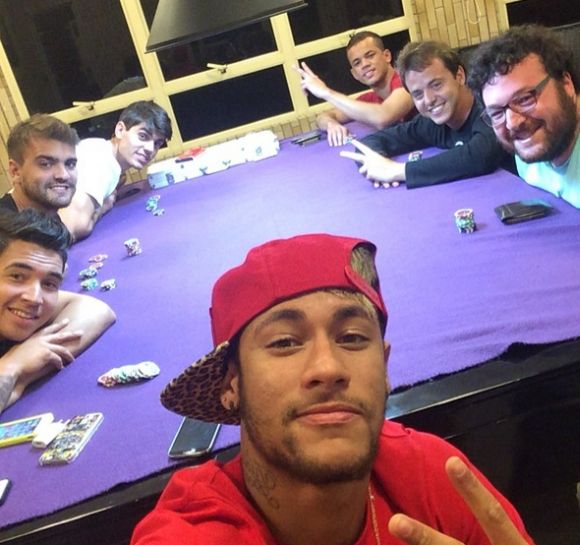 Neymar taking a selfie playing poker