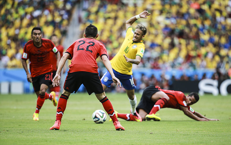 Neymar getting taclked in a game for Brazil
