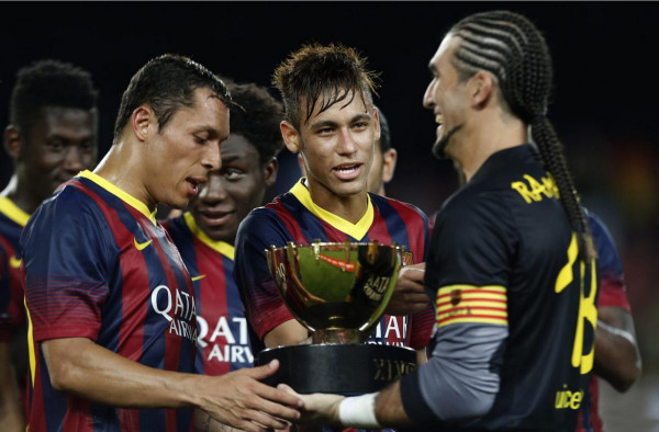 Neymar holding his first trophy at Barcelona, in 2013