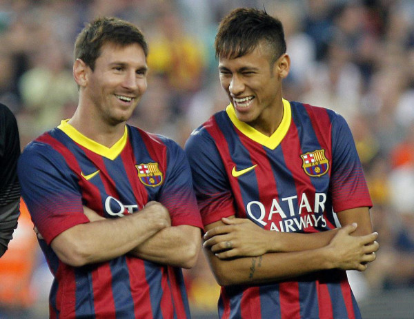 Neymar next to Lionel Messi, smiling and laughing