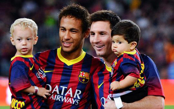 Lionel Messi and Neymar holding their own sons at the Camp Nou