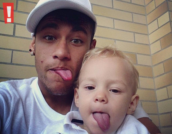 Neymar and his son David Lucca, making funny faces to the camera