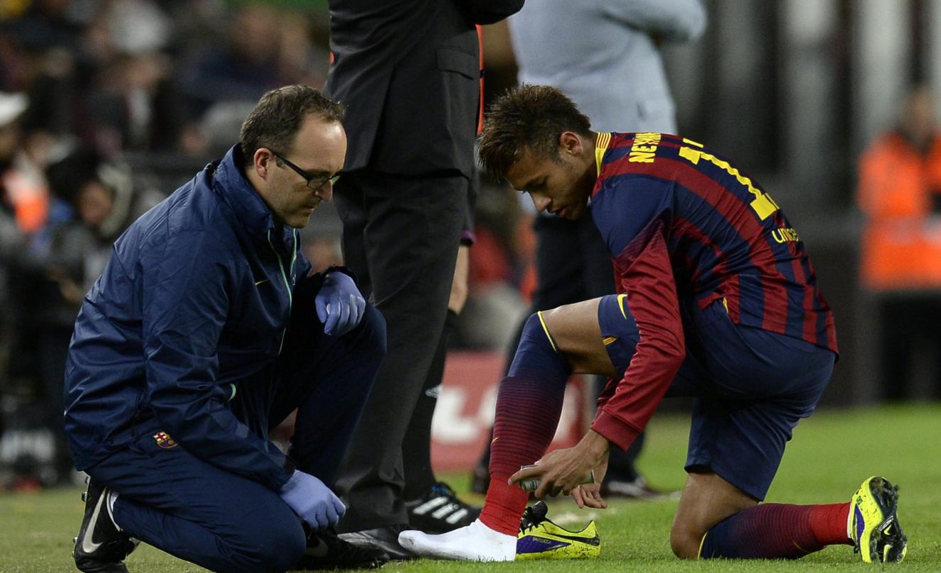 Neymar changing his football boots in Barcelona