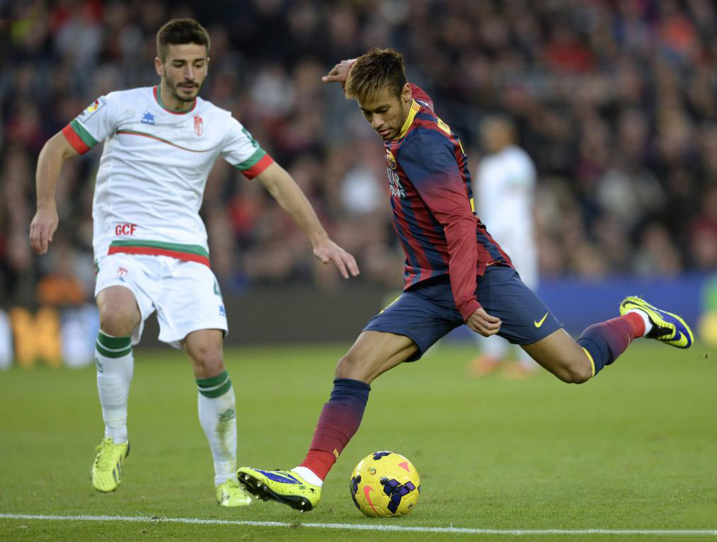 Neymar preparing to strike the ball with his left foot