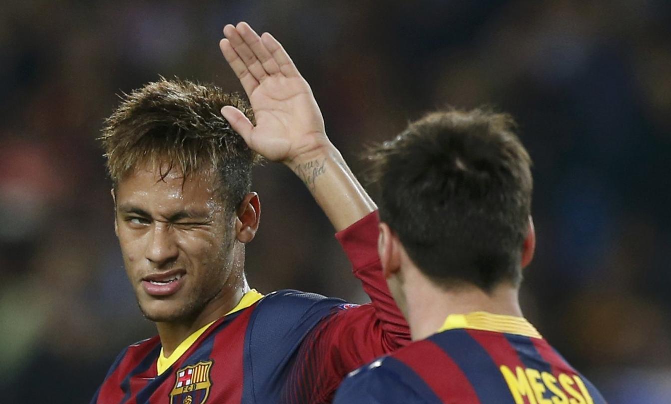 Neymar winking at Lionel Messi