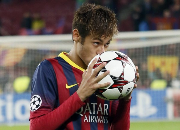 Neymar kissing the hat-trick game ball