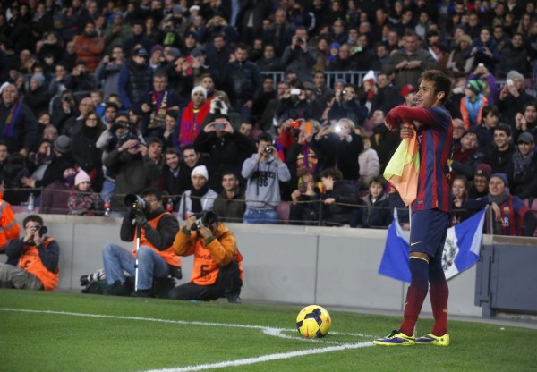 Neymar playing with the corner kick flag