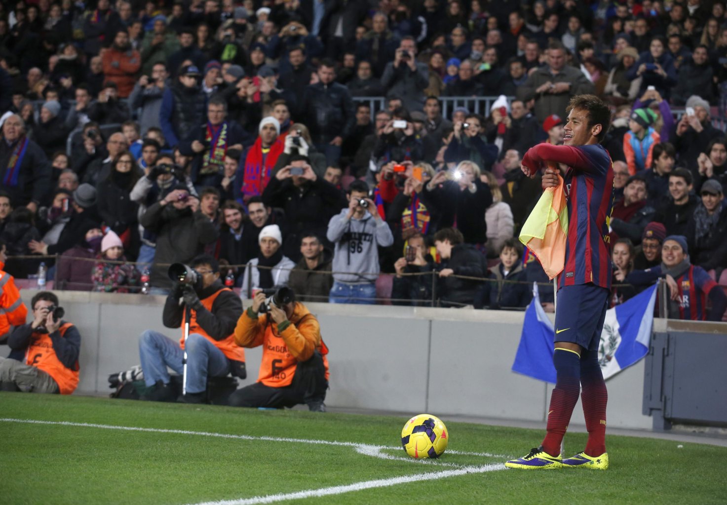 Neymar playing with the corner kick flag