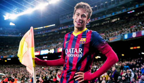 Neymar smiling next to the corner flag