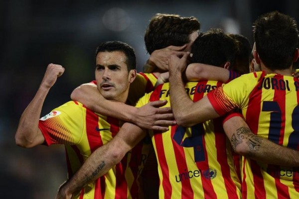 Pedro celebrating Barcelona's hat-trick, with his teammates