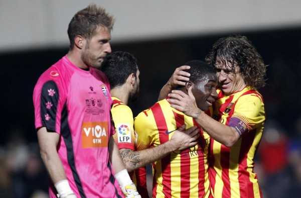 Puyol congratulating Dongou for his first goal for Barcelona