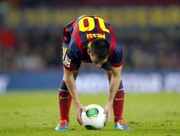 Lionel Messi preparing to take a free-kick for Barcelona