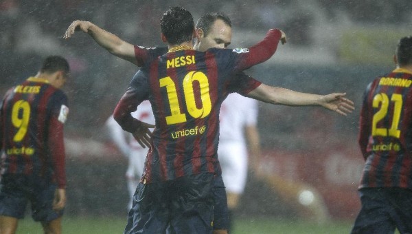 Lionel Messi hugging Andrés Iniesta