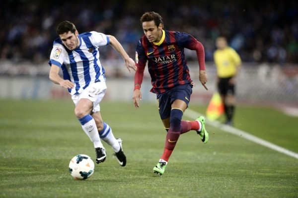 Neymar running past a defender