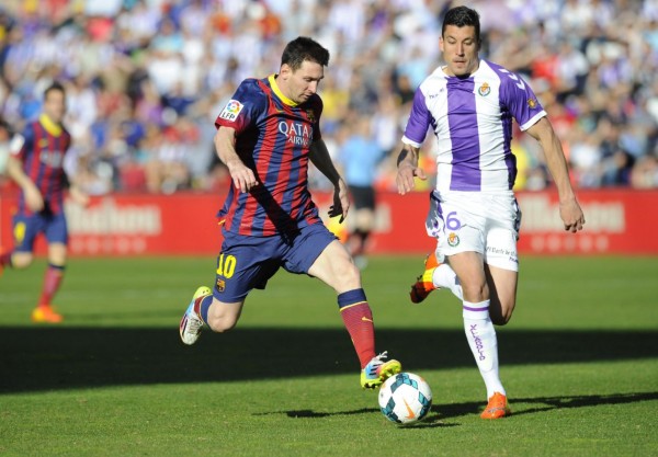 Lionel Messi racing with the ball