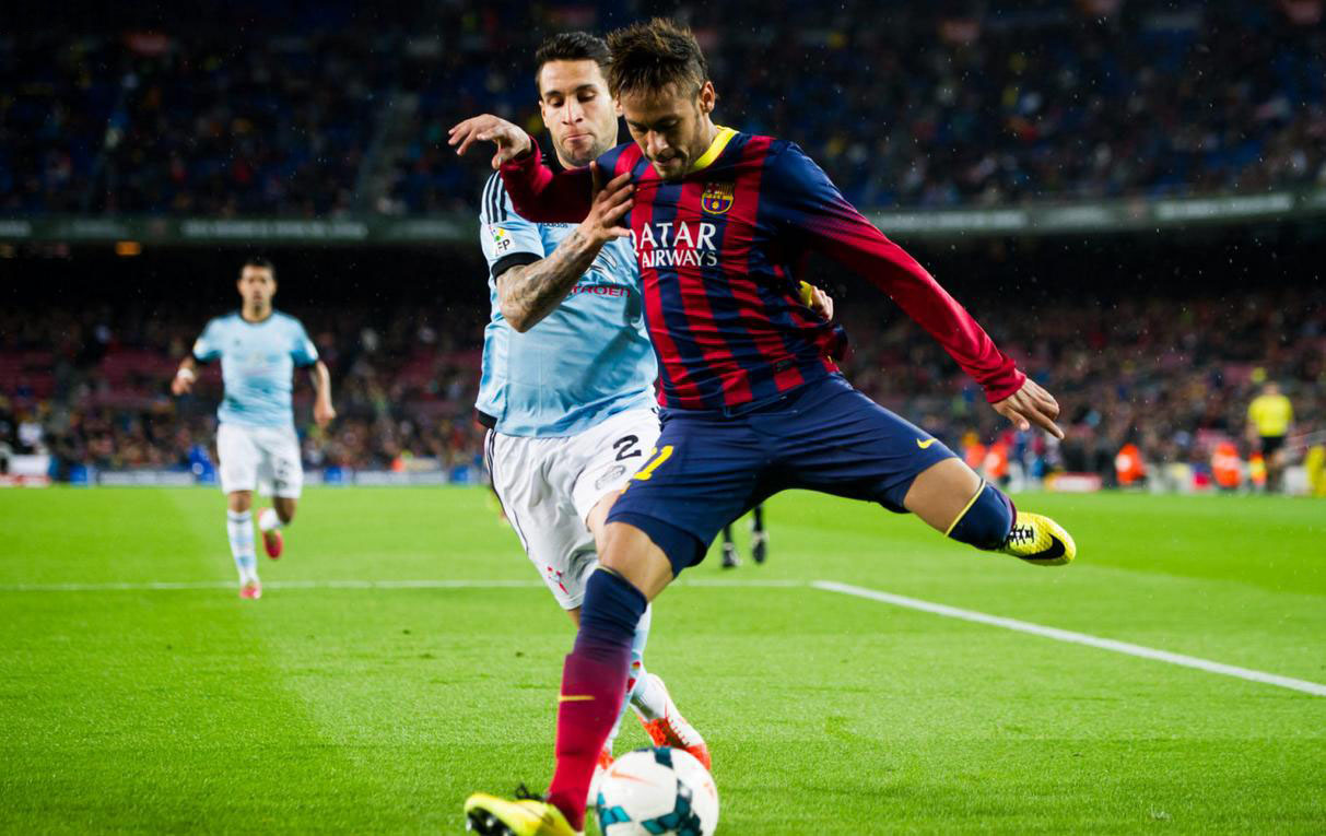 Neymar getting in front of a defender