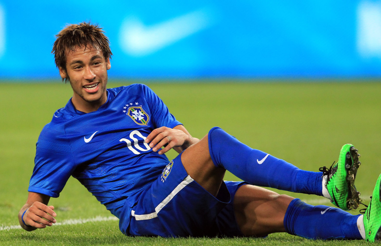 Neymar lying on the ground in a Brazil match