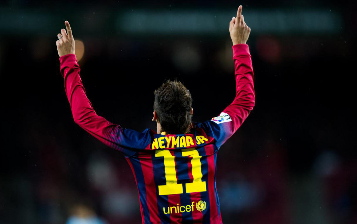 Neymar pointing his fingers to the sky