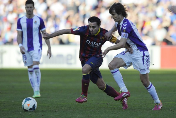 Xavi commanding Barcelona's midfield