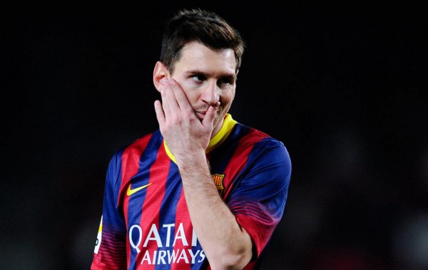 Lionel Messi scratching his own face