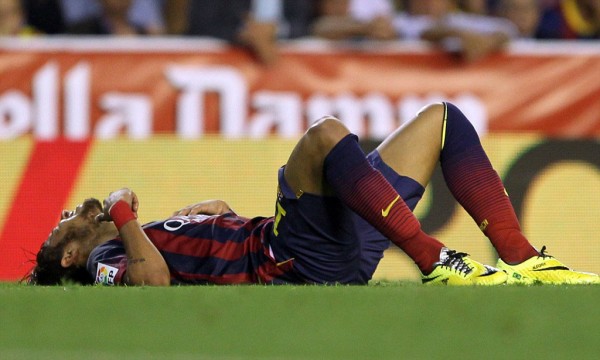 Neymar layed down on the grass