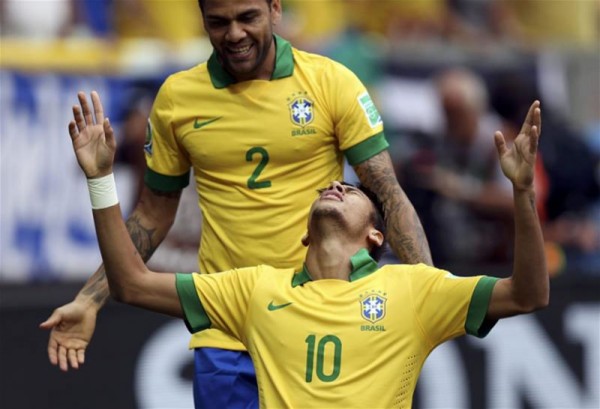 Daniel Alves and Neymar celebrating a goal for Brazil