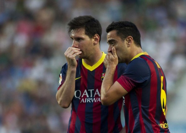 Messi and Xavi in a FC Barcelona match