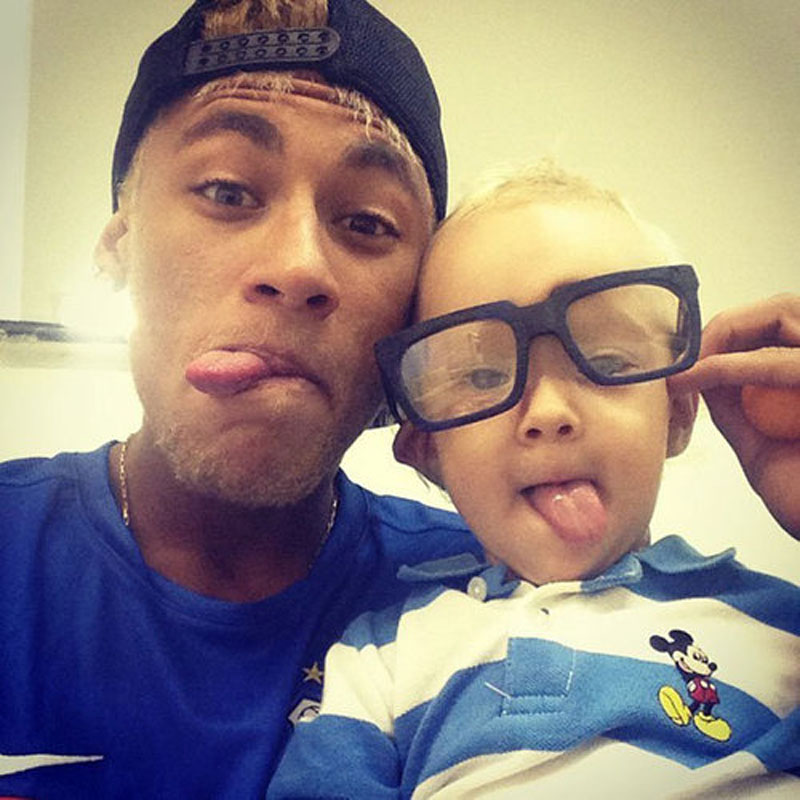 Neymar and his son David Lucca, wearing eye glasses