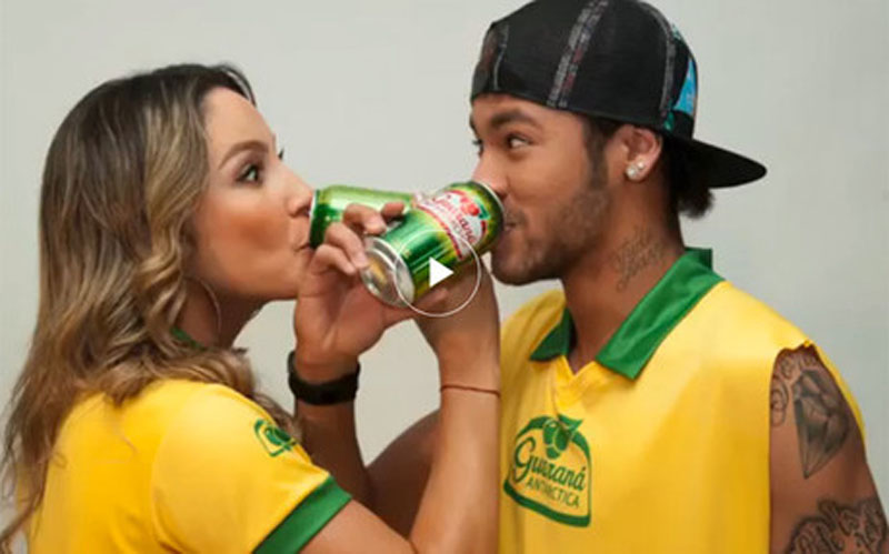 Neymar in a Brazil World Cup Guarana campaign photo, with a Brazilian model