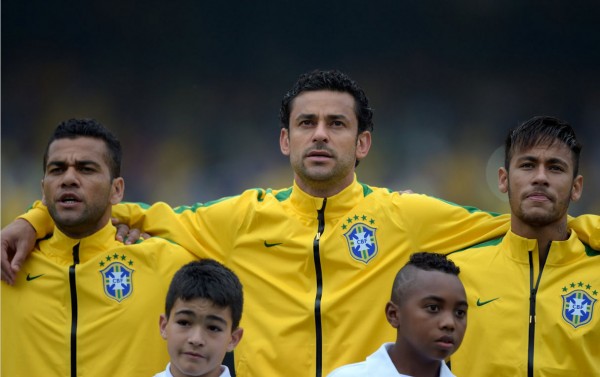 Daniel Alves, Fred and Neymar, singing the Brazilian hymn