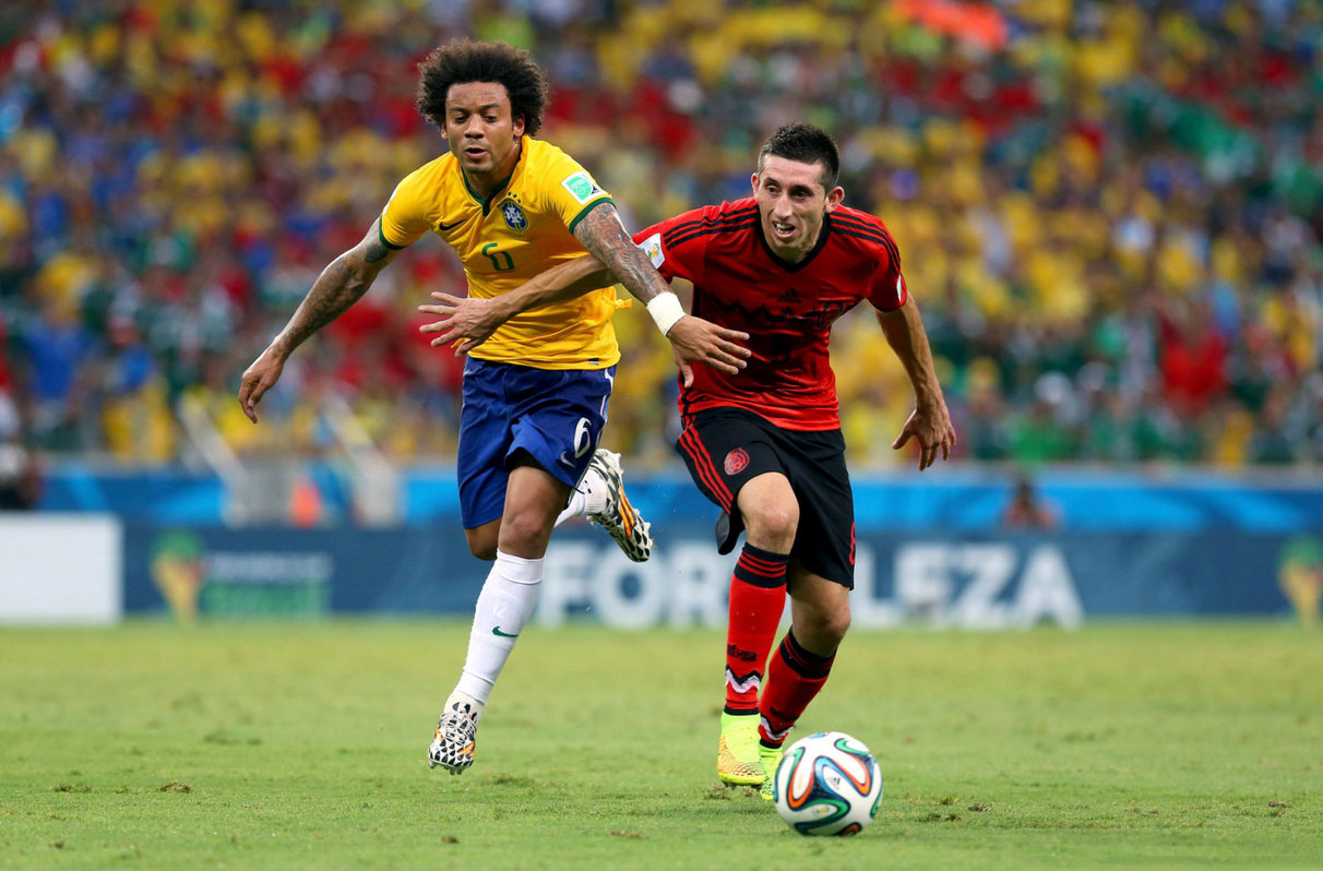 Marcelo and Herrera in Brazil vs Mexico in the FIFA World Cup 2014
