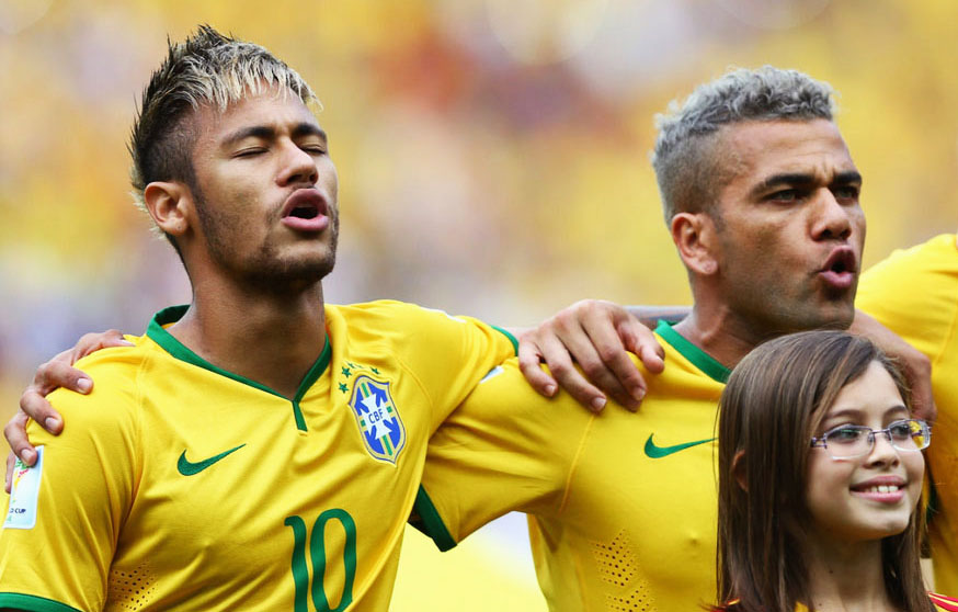 Neymar and Daniel Alves singing Brazil's National Anthem with a new hairstyle and visual for the FIFA World Cup 2014