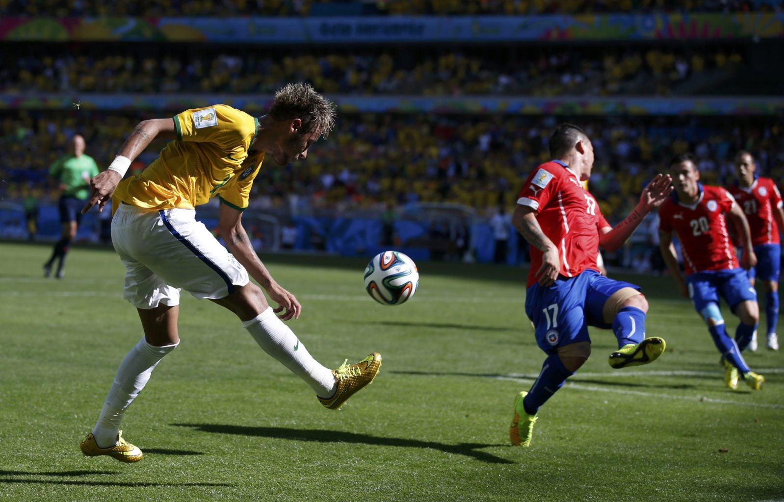 Neymar crossing the ball, in Brazil vs Chile at the FIFA World Cup 2014